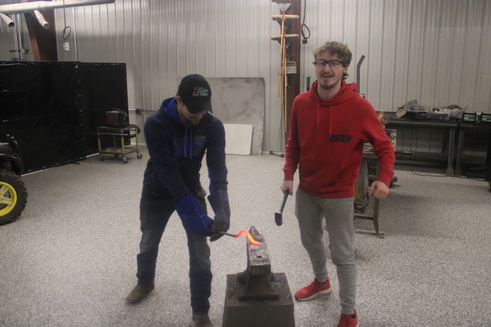 Students work in the shop with new flooring