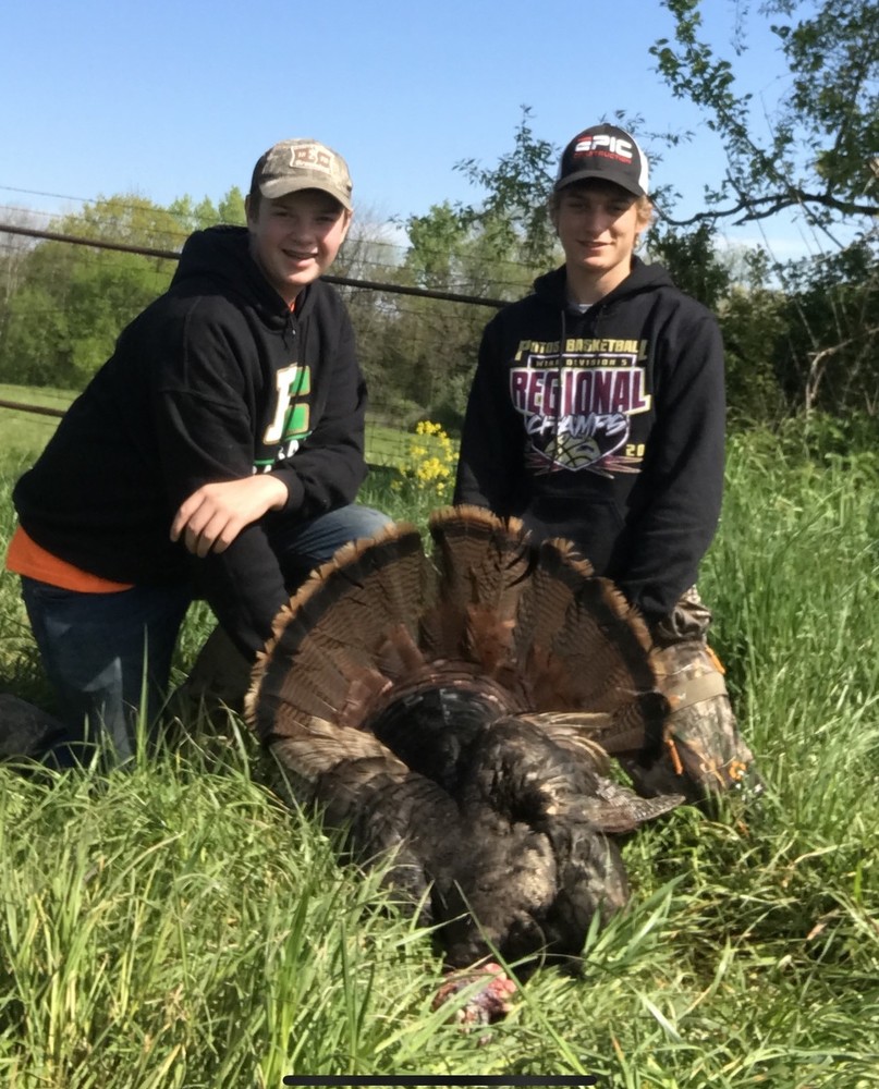 Cooper and Sam with a turkey